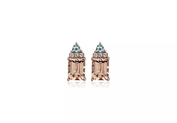 A pair of emerald-cut morganite earrings layered with trillion shaped aquamarine gemstones separated by three pavé diamonds